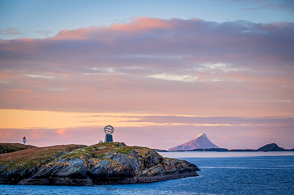 View of the arctic circle globe with the Hestmannen in the background in the morning light, Vikingen, Rödöy, Nordland, Norway, Europe