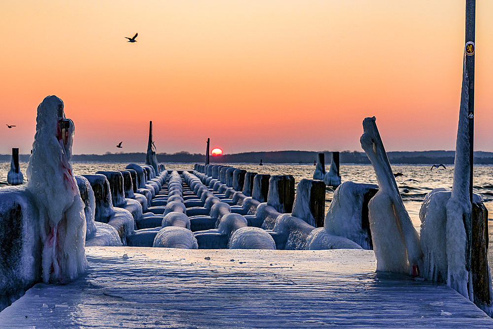 Icy old wooden pier on the beach, Travemünde, Bay of Lübeck, Schleswig Holstein, Germany