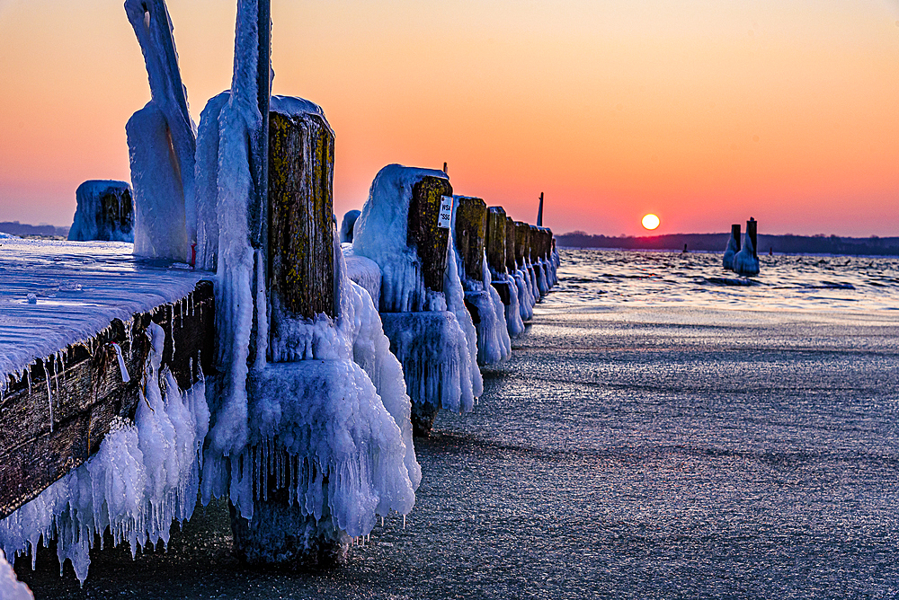 Icy old wooden pier on the beach, Travemünde, Bay of Lübeck, Schleswig Holstein, Germany