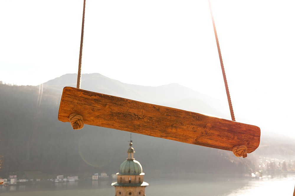 Empty Swing with Mountain View and Sunlight over Lake Lugano in Morcote, Ticino in Switzerland.