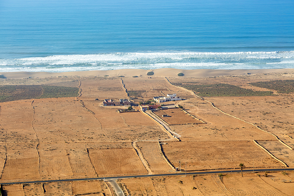 View over coastal plain to Atlantic Ocean coastline from Tamellalt, southern Morocco, north Africa,