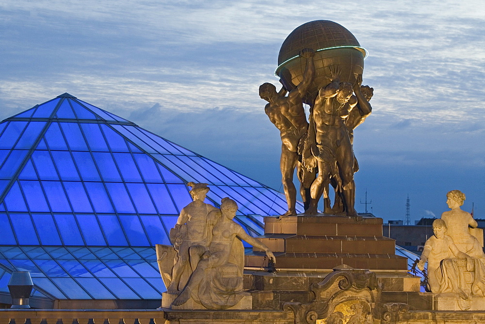 atlas figures holding globe, Museum for Communication at night, Berlin