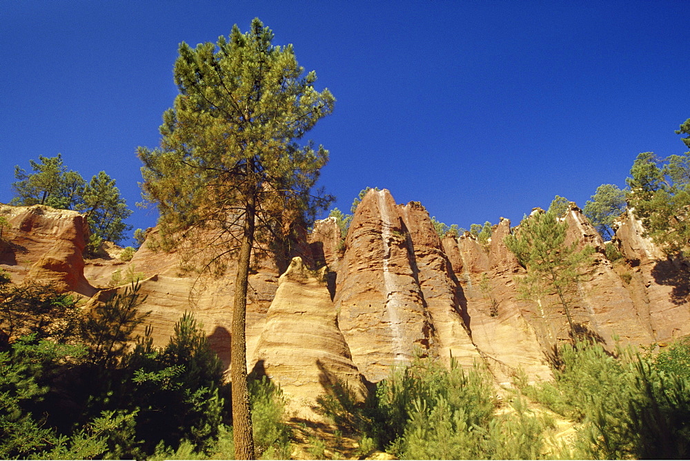 Ochre rocks at Val de FÃˆes under blue sky, Vaucluse, Provence, France, Europe