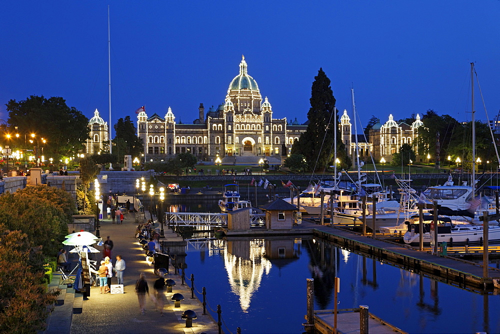 Victoria harbour and illuminated parliament at twilight in Victoria, Vancouver Island, Canada, North America