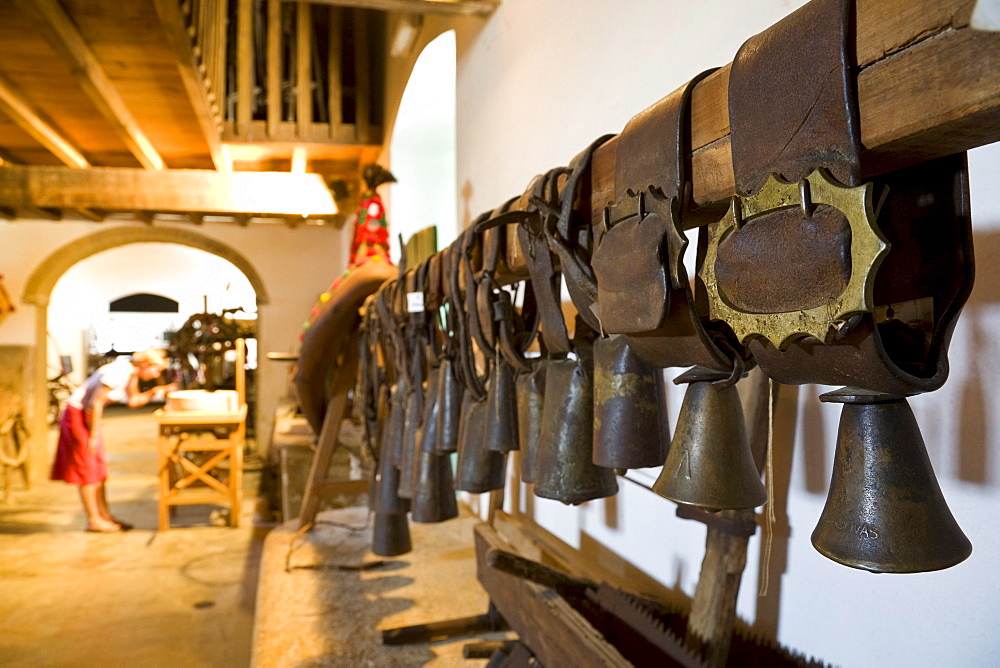 Cowbells, visitor in the ethnographic museum, Museu Etnografico do Trajo Algarvio, Sao Bras de Alportel, Algarve, Portugal