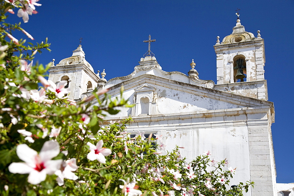 Santo Antonio Church with almond blossoms, Lagos, Algarve, Portugal