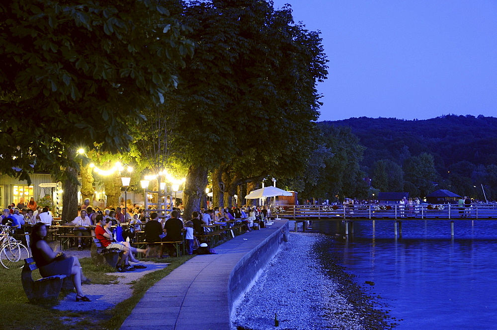 Guests in a beer garden at lakefront promenade, Herrsching am Ammersee, Bavaria, Germany