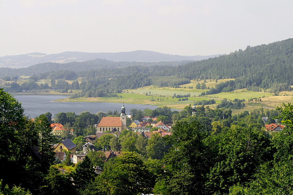 View at the town Sosnowka in front of a lake at an idyllic scenery, Sosnowka, Bohemian mountains, lower-Silesia, Poland, Europe