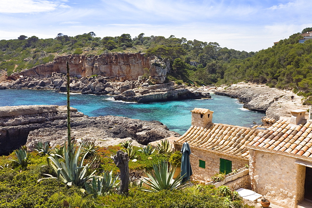 Houses on shore under clouded sky, Cala s'Almonia, Mallorca, Spain, Europe