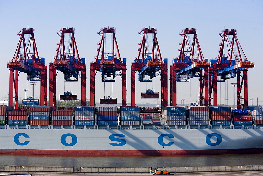 Container ship at container gantry crane, Port of Hamburg, Germany