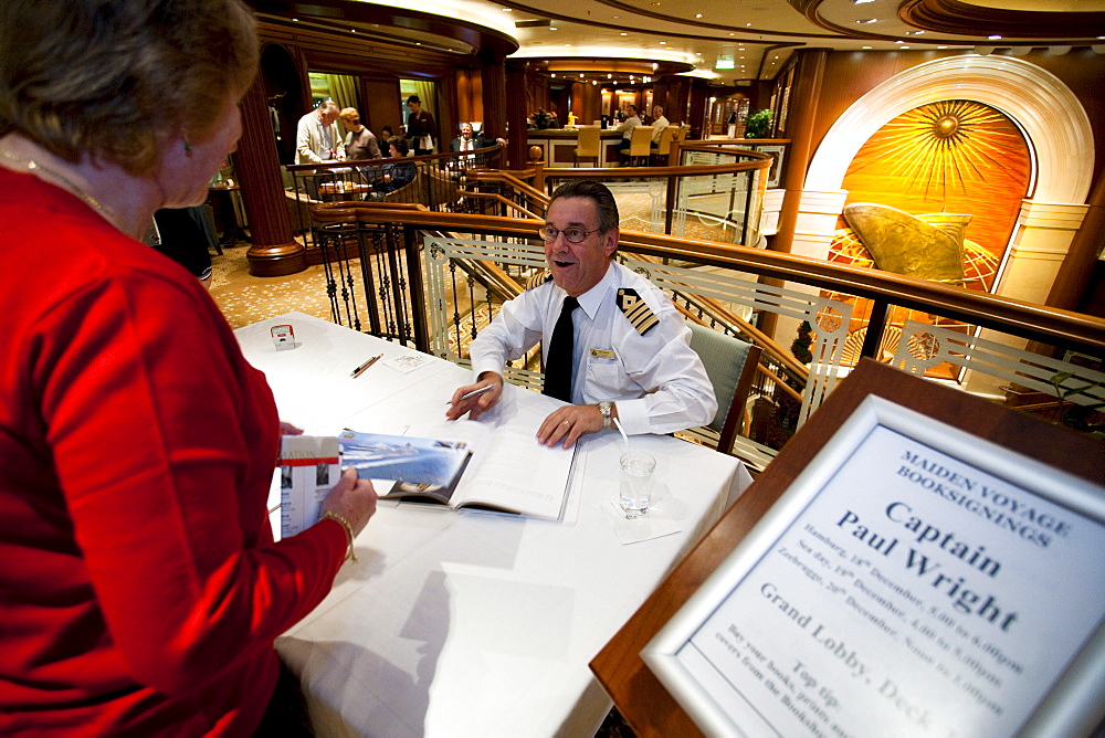 Book-signing with captain Paul Wright, Grand Lobby, cruise liner Queen Victoria