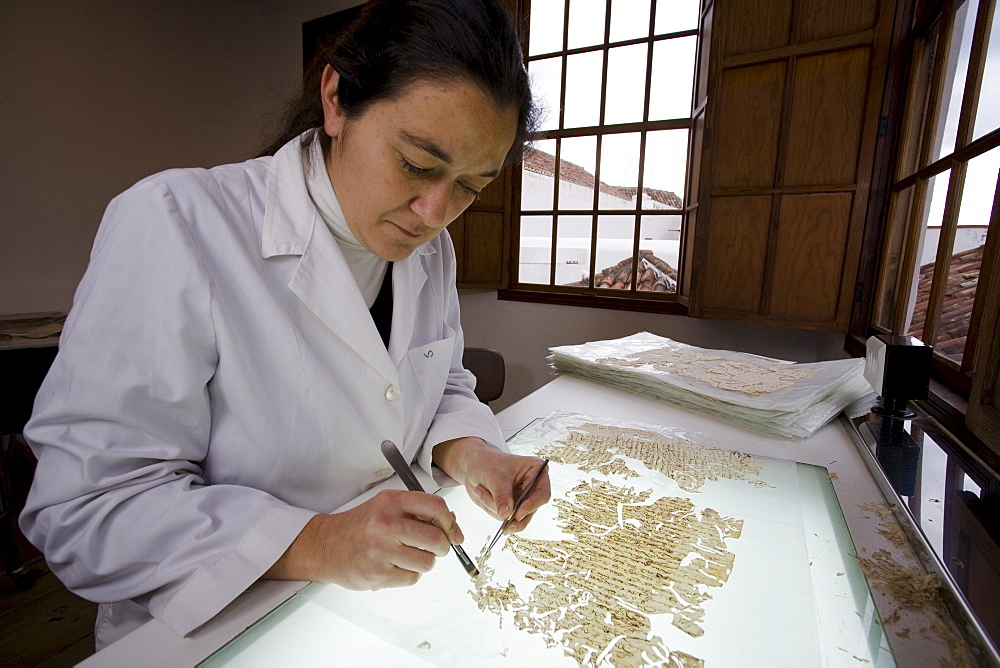 Female conservator, restorer restoring a document, paper, Centro de Conservacion y Restauracion de Documentos Graficos, Santa Cruz de La Palma, La Palma, Canary Islands, Spain, Europe