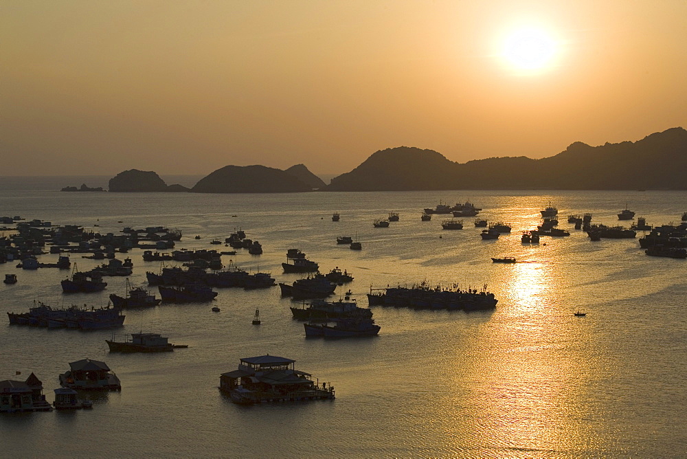 Sunset over the harbour of Cat-Ba Town, Halong Bay at the Gulf of Tonkin, Vietnam, Asia