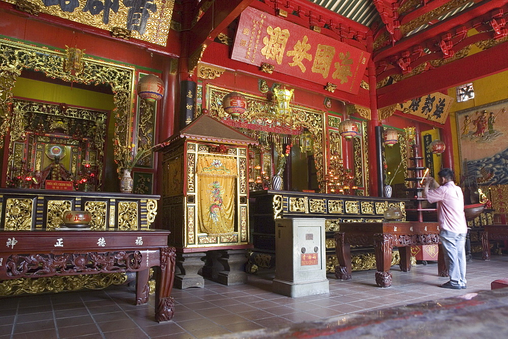 Praying man at chinese pagoda at Cholon, Saigon, Hoh Chi Minh City, Vietnam, Asia