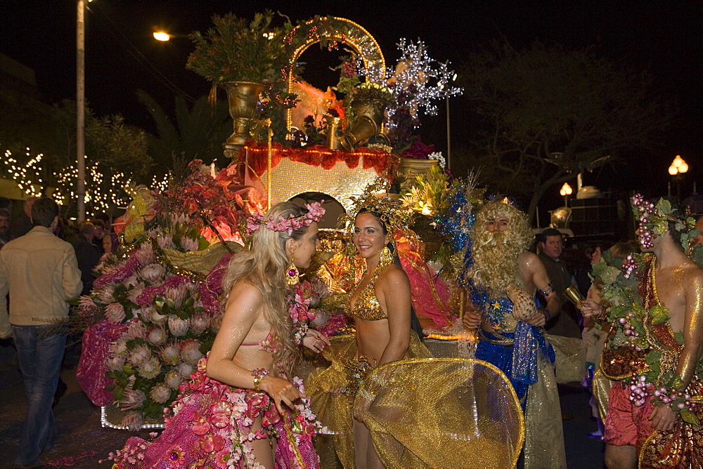 Young women in colourful costumes at the Carnival Parade, Funchal, Madeira, Portugal
