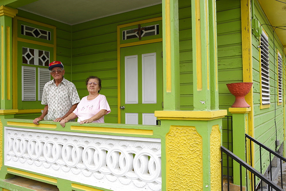 An elderly couple on their porch, San German, Puerto Rico, Carribean, America