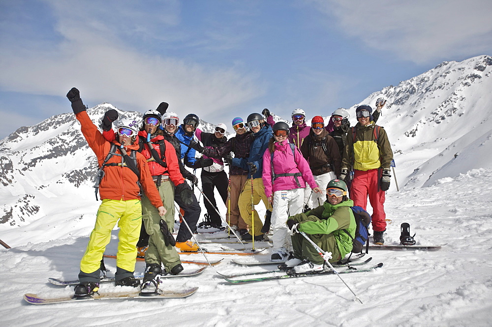 Group of snowboarders and skiers in snow, See, Tyrol, Austria