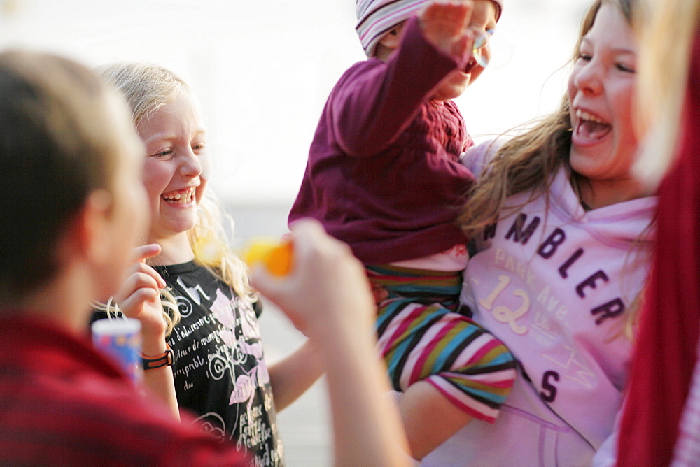 Laughing children, lake Worthsee, Bavaria, Germany