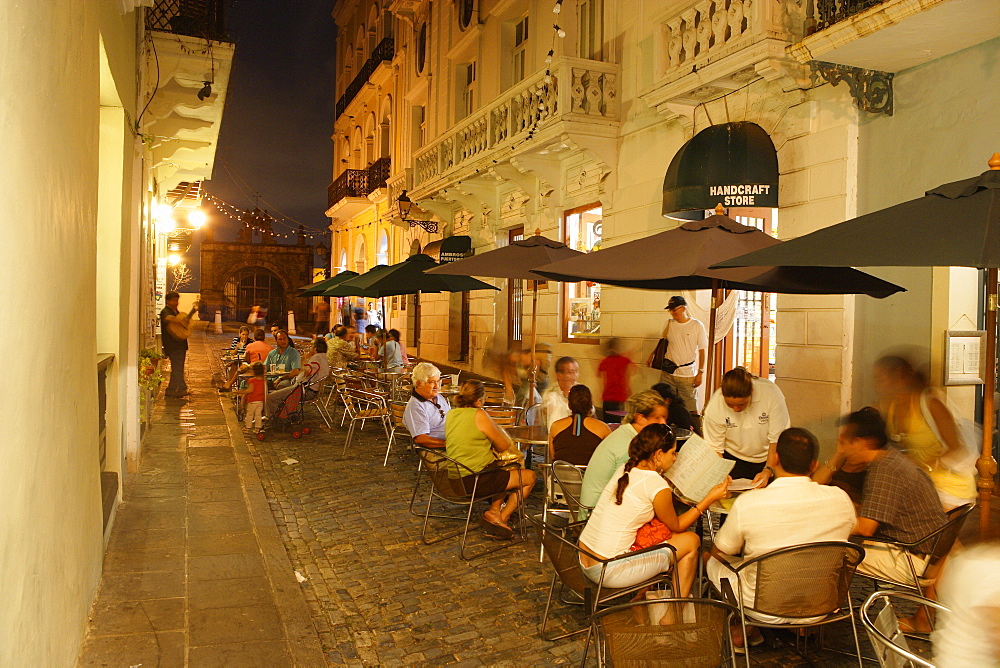 People sitting in front of a cafe at the Old Town in the evening, Calle de Christo, San Juan, Puerto Rico, Carribean, America