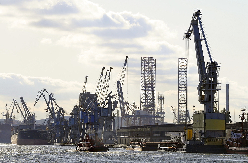 Harbour and dockyard under clouded sky, Gdansk, Poland, Europe