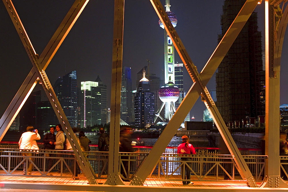 The illuminated Waibaidu bridge above the Souzhou canal at night, Bund, Shanghai, China, Asia