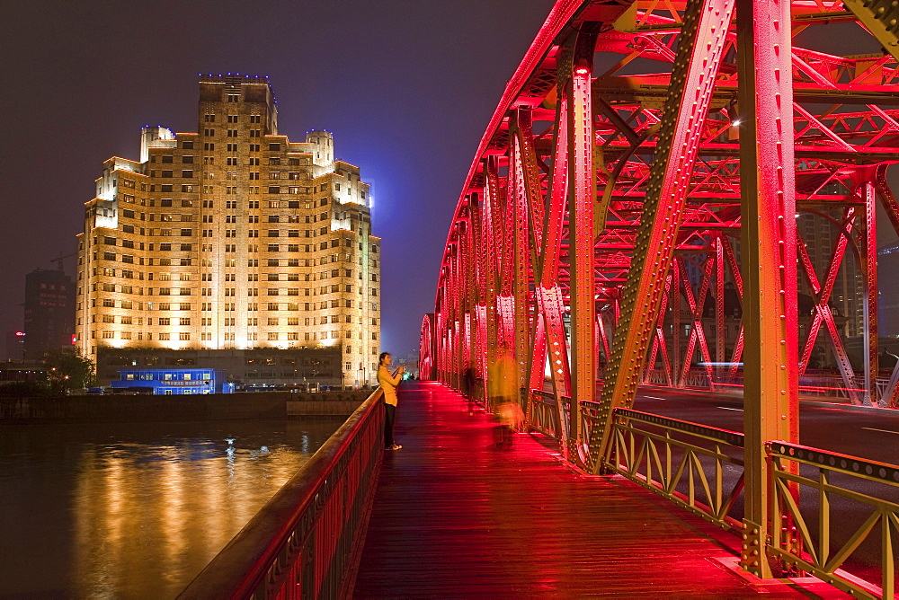 The illuminated Waibaidu bridge above the Souzhou canal at night, Bund, Shanghai, China, Asia