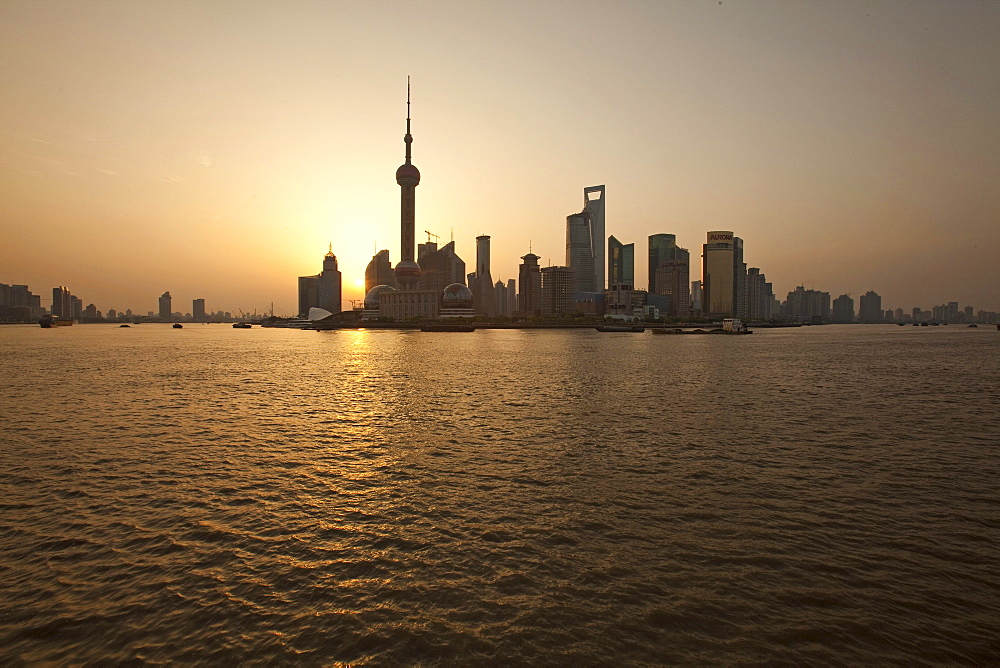 Skyline of Pudong at Huangpu river at sunrise, Pudong, Shanghai, China, Asia