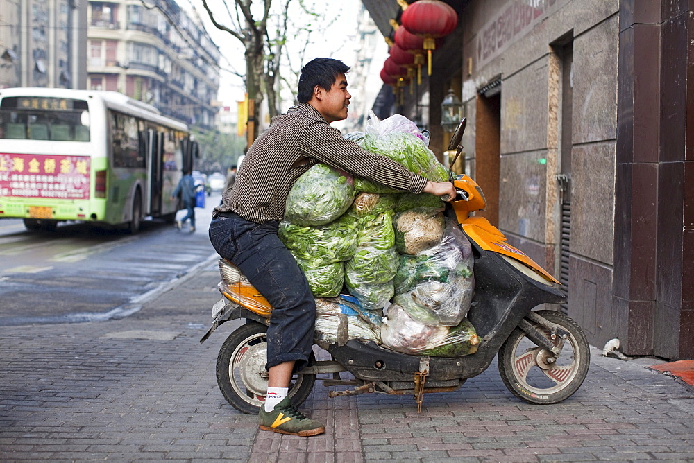 Man transporting vegetables on a scooter, Fuzhou Road, Shanghai, China, Asia