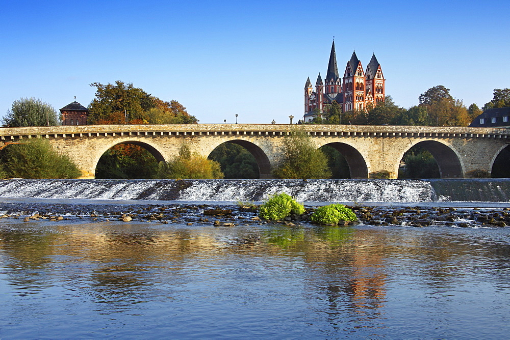 View over Lahn river with bridge to cathedral, Limburg, Hesse, Germany