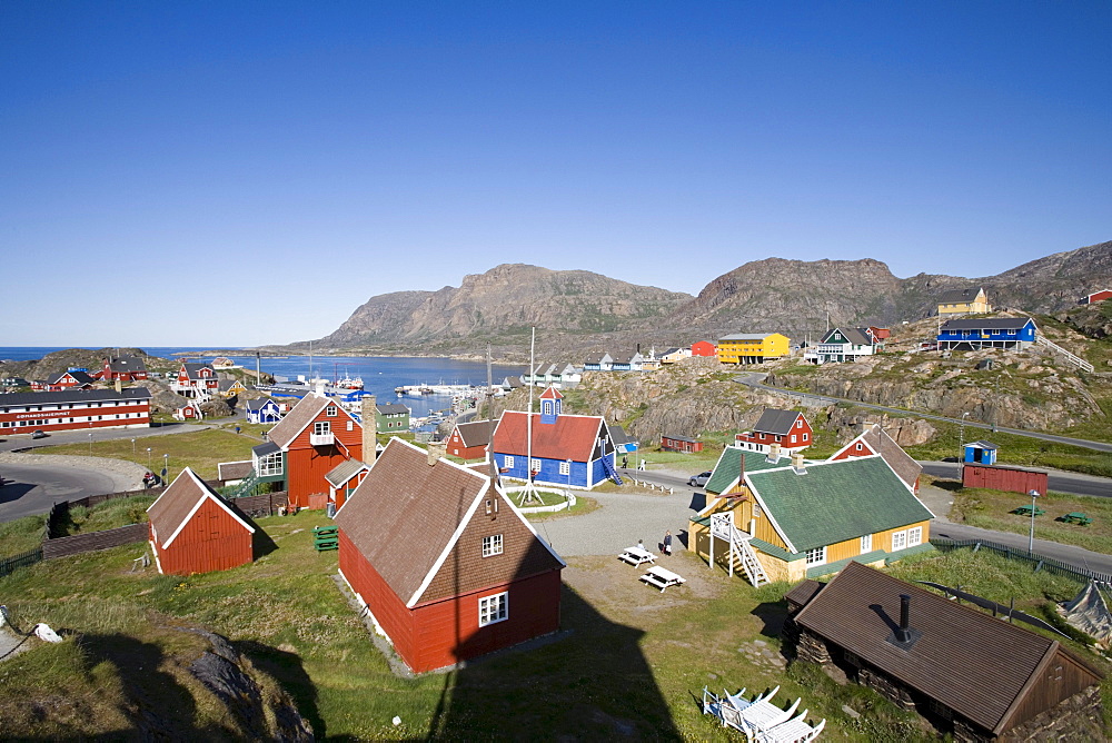 Wooden houses on the waterfront under blue sky, Sisimiut, Kitaa, Greenland