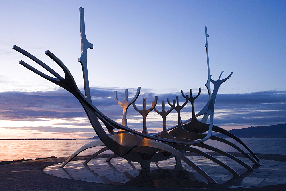 Sculpture of a viking ship on the waterfront in the evening, Reykjavik, Iceland, Europe