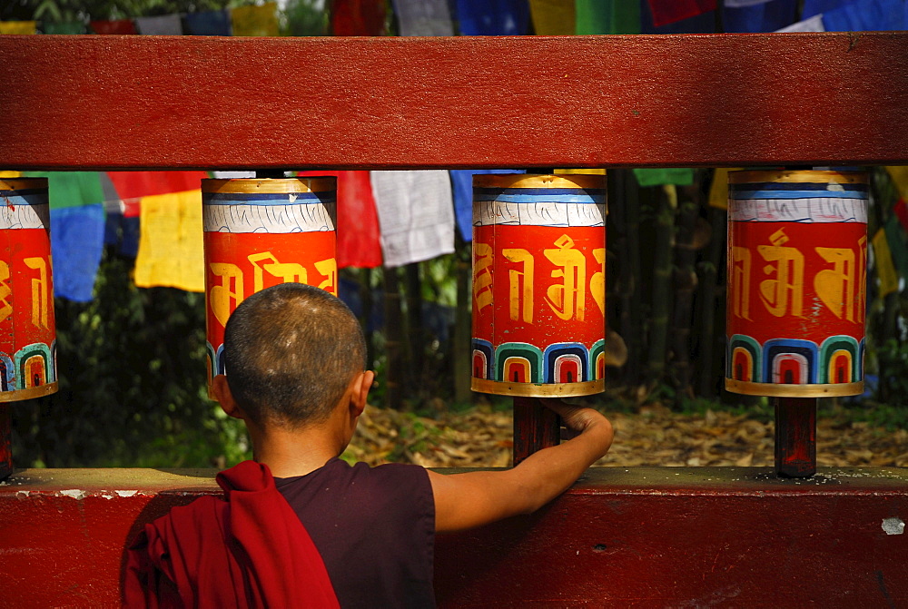 Novice with prayer wheel, Enchey monastery, Sikkim, Himalaya, Northern India, Asia