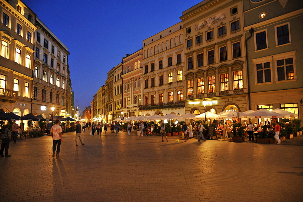 Rynek glowny, market place with street cafes in the evening, Krakow, Poland, Europe