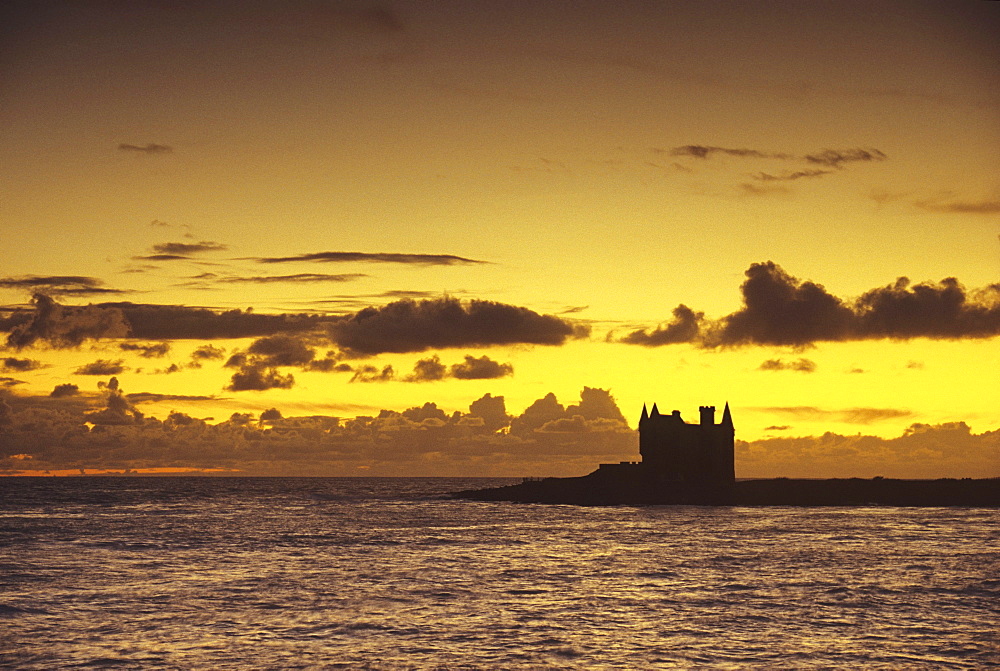 Evening mood with Chateau Turpeau on the waterfront, Cote Sauvage, Quiberon, Brittany, France, Europe