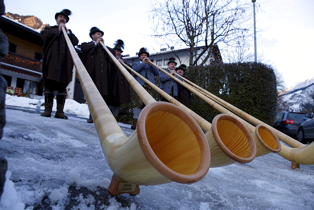 Band of Alpenhorns blowers at the Christmas market in Bad Hindelang, Allgau, Swabia, Bavaria, Germany