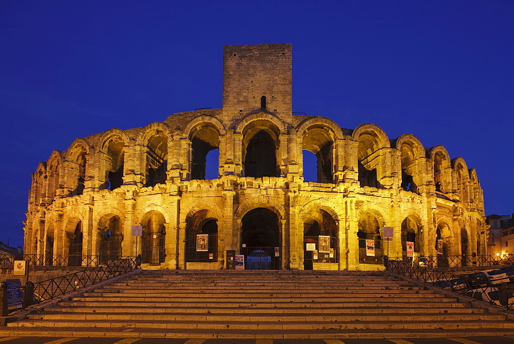 The illuminated amphitheatre in the evening, Arles, Bouches-du-Rhone, Provence, France