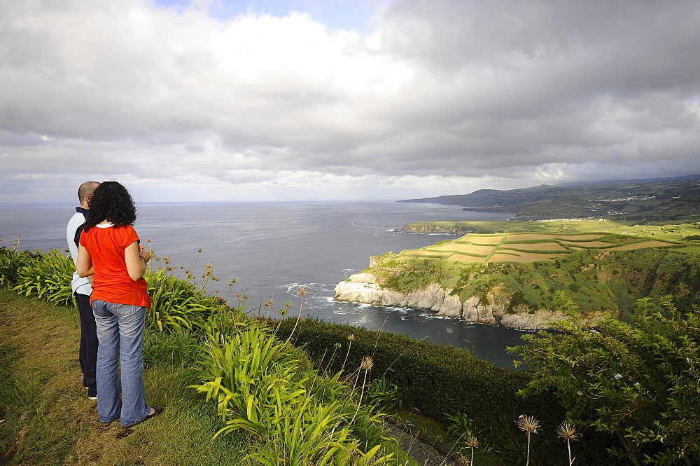 Couple admiring the view at Iria viewpoint, Northcoast, Sao Miguel Island, Azores, Portugal