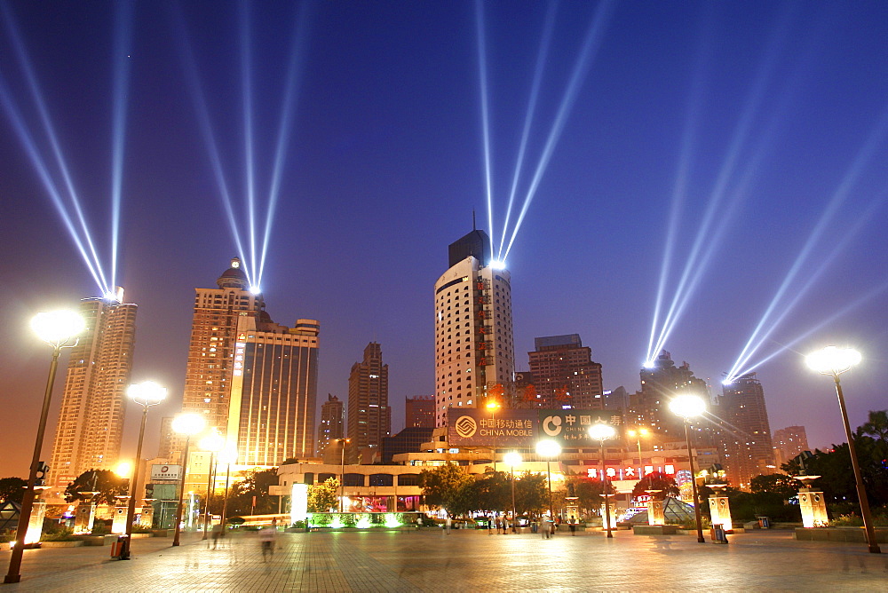 Festive floodlights on skyscrapers illuminate the sky at the port of Chongqing, China, Asia