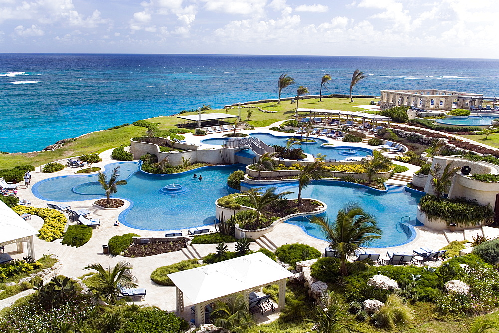 View over swimming pool area of the Crane Hotel, Atlantic Ocean in background, Barbados, Caribbean