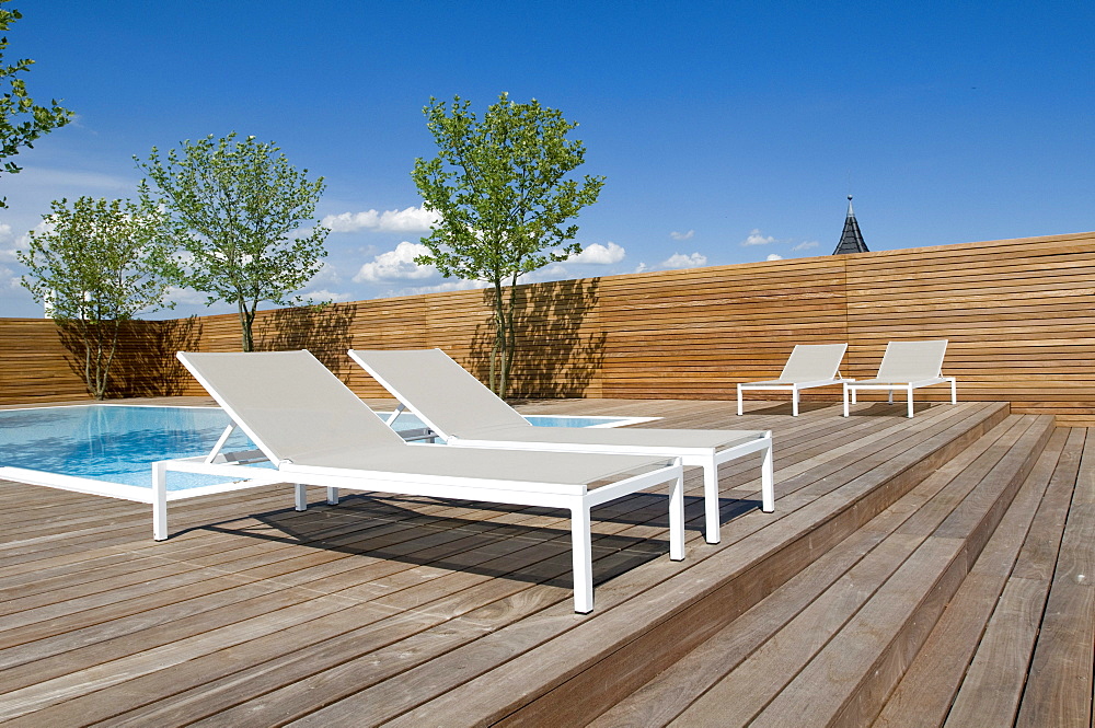 View at sunloungers at the deserted terrace under blue sky, Hotel Riva, Constance, Lake Constance, Baden-Wurttemberg, Germany