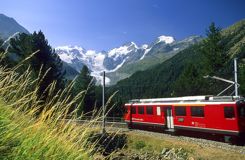 Red Train of Rhaetische Bahn in front of mountain range of Bellavista, Piz Argient, Crast Aguezza, Piz Bernina, Piz Prievlus and Piz Morteratsch, Ferrovia Raetia, Bernina range, Bernina, Morteratsch, Oberengadin, Engadin, Grisons, Switzerland