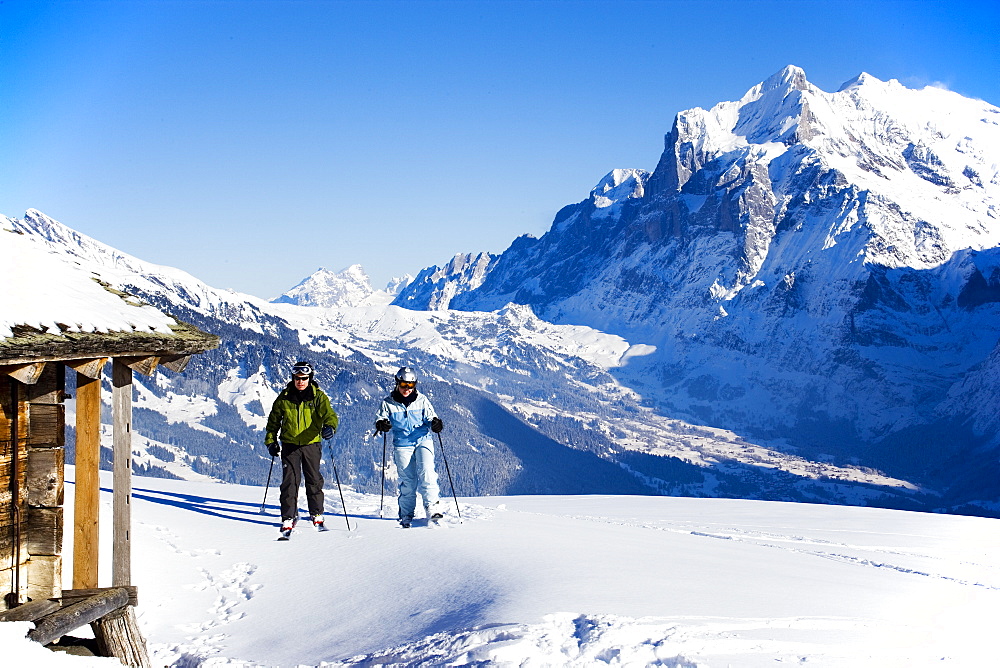 Back country skiers near an alpine hut, Maennlichen, Grindelwald, Bernese Oberland, Canton of Bern, Switzerland