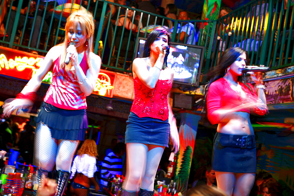 Salsa singers, three women singing at Mango's Nightclub, Ocean Drive, South Beach, Miami Beach, Florida, USA