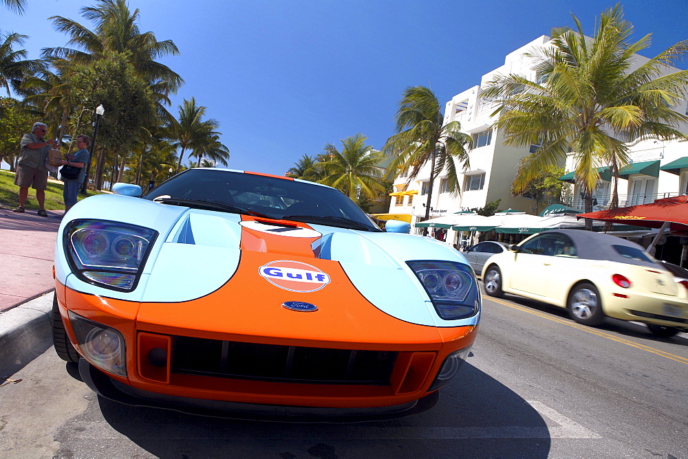 Sports car parking on Ocean Drive under blue sky, South Beach, Miami Beach, Florida, USA