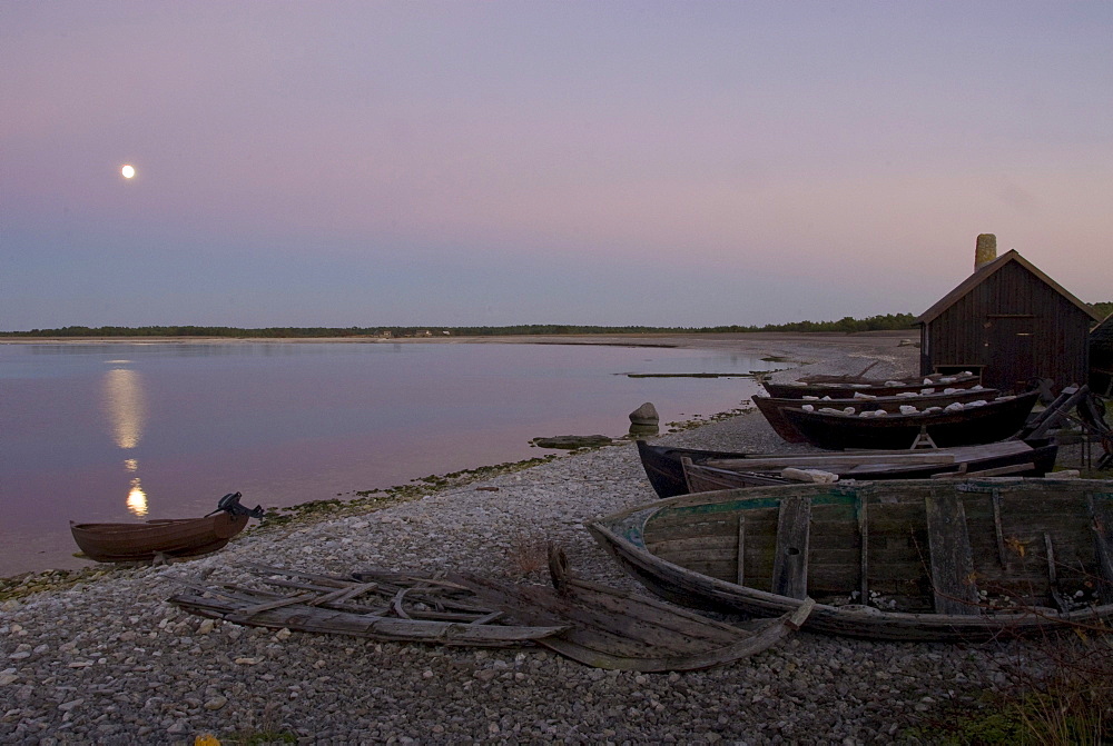 Wooden hut and boats on the beach, Faro, North coast, Gotland, Sweden, Scandinavia, Europe