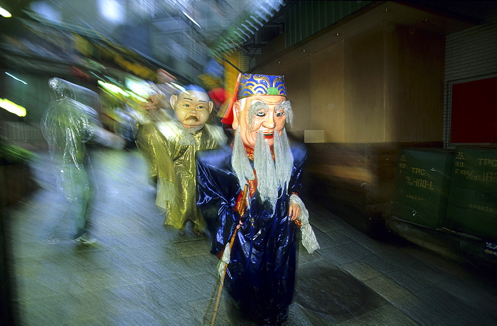 Peole wearing masks at a funeral procession at Chiufen, Taiwan, Asia