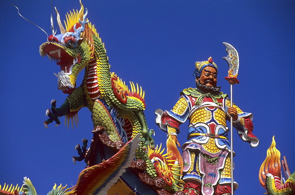 Colourful figures on a Tao temple under blue sky, Taiwan, Asia