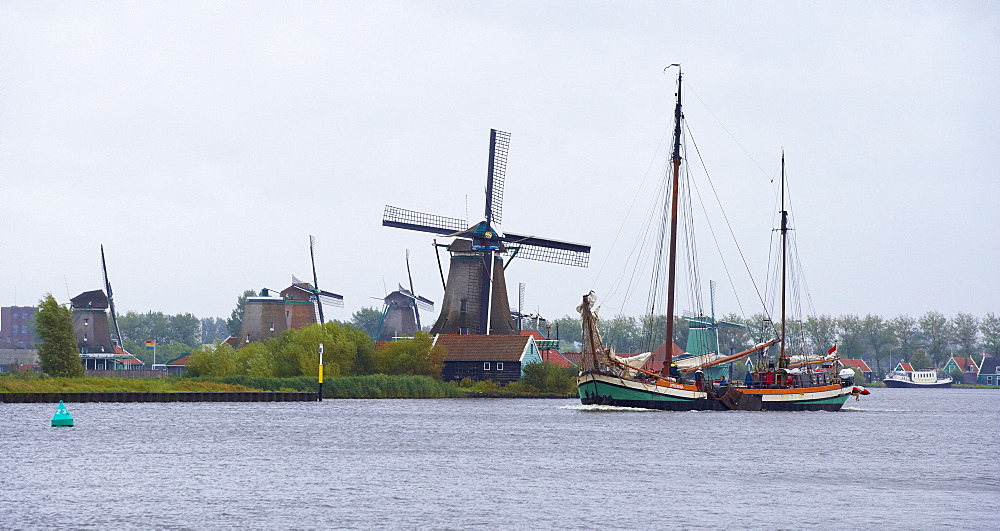 View at windmills at open-air museum Zaanseschans at the river Zaan, Netherlands, Europe