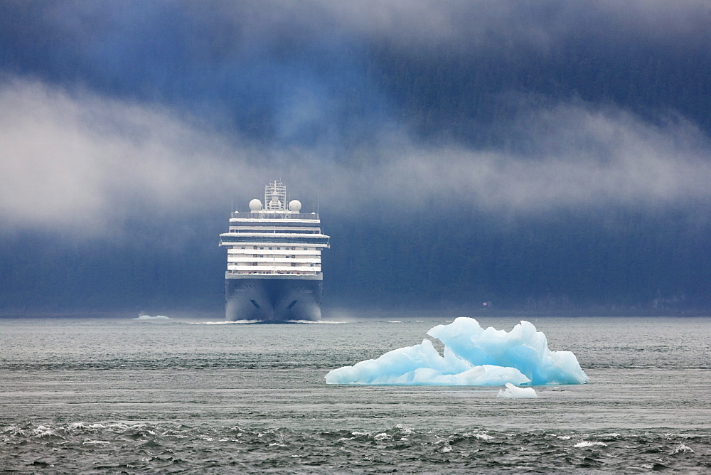 Cruiseship approaching a little iceberg, Inside Passage, Alaska, USA