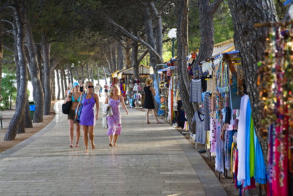 Tourists and sales stalls at the promenade, Bol, Brac Island, Dalmatia, Croatia, Europe